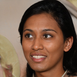 Joyful latino young-adult female with medium  black hair and brown eyes