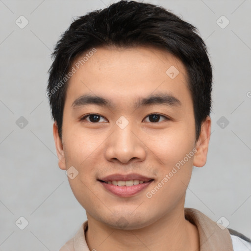 Joyful asian young-adult male with short  black hair and brown eyes