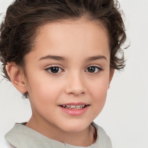 Joyful white child female with short  brown hair and brown eyes