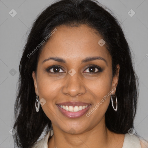 Joyful black young-adult female with long  brown hair and brown eyes