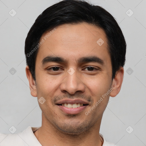 Joyful white young-adult male with short  black hair and brown eyes