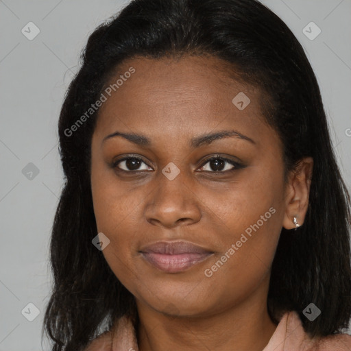 Joyful black young-adult female with long  brown hair and brown eyes