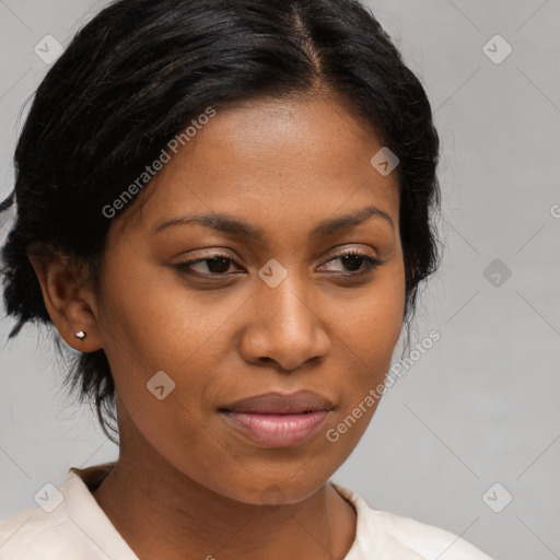 Joyful black young-adult female with medium  brown hair and brown eyes