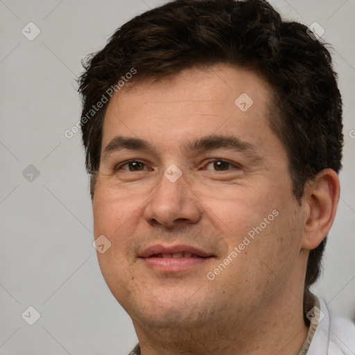 Joyful white adult male with short  brown hair and brown eyes