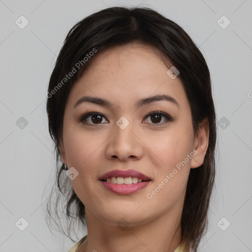 Joyful latino young-adult female with medium  brown hair and brown eyes