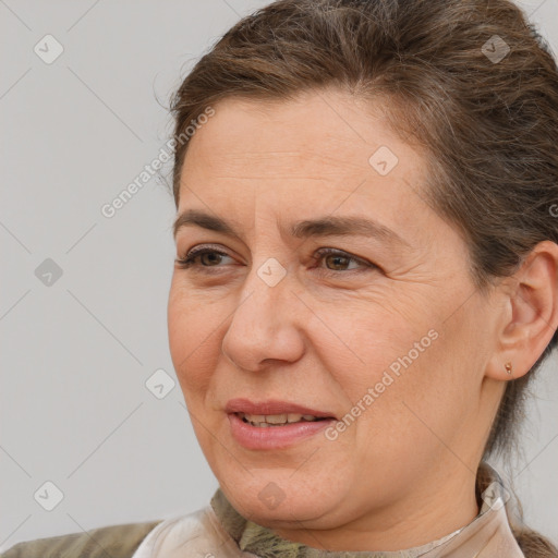 Joyful white adult female with short  brown hair and brown eyes