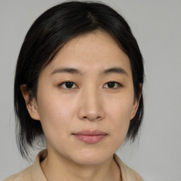 Neutral asian young-adult female with medium  brown hair and brown eyes