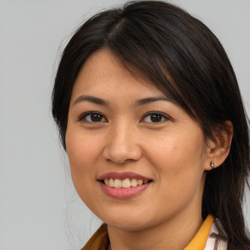 Joyful white young-adult female with medium  brown hair and brown eyes