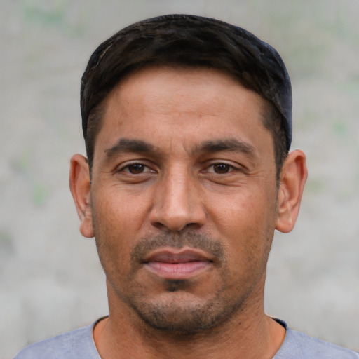 Neutral white young-adult male with short  black hair and brown eyes