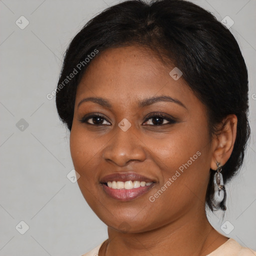 Joyful black young-adult female with medium  black hair and brown eyes