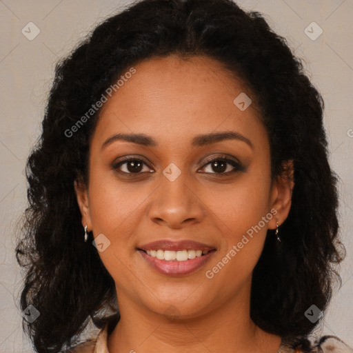 Joyful black young-adult female with long  brown hair and brown eyes