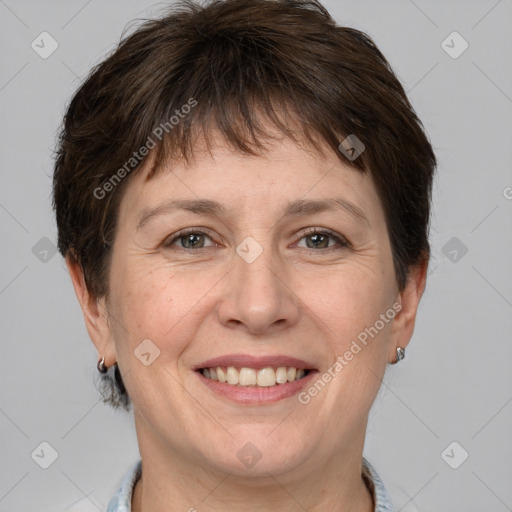 Joyful white adult female with short  brown hair and grey eyes