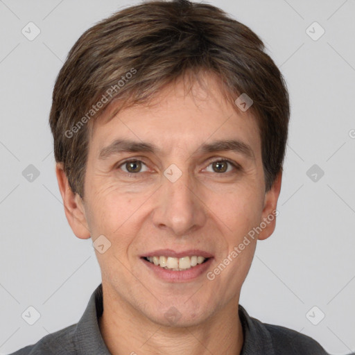 Joyful white adult male with short  brown hair and brown eyes