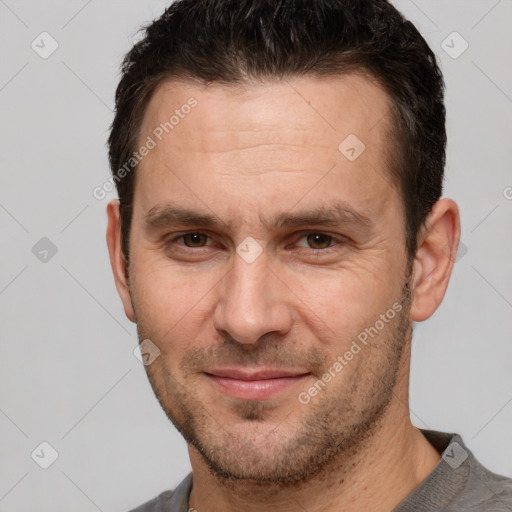 Joyful white adult male with short  brown hair and brown eyes