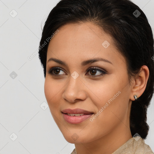 Joyful latino young-adult female with medium  brown hair and brown eyes