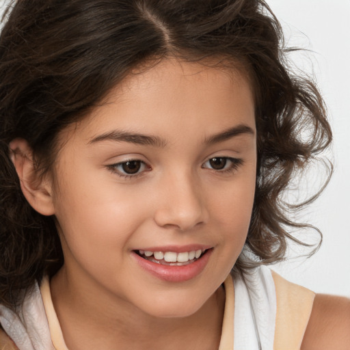 Joyful white child female with medium  brown hair and brown eyes