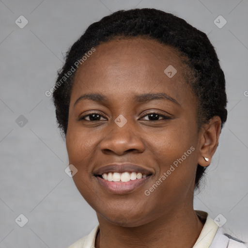 Joyful black young-adult female with short  black hair and brown eyes