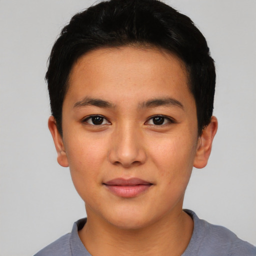 Joyful asian young-adult female with short  black hair and brown eyes
