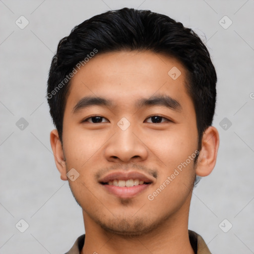 Joyful asian young-adult male with short  black hair and brown eyes