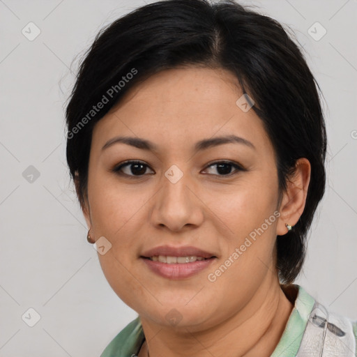 Joyful asian adult female with medium  brown hair and brown eyes