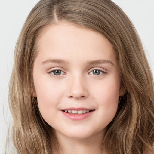 Joyful white child female with long  brown hair and brown eyes