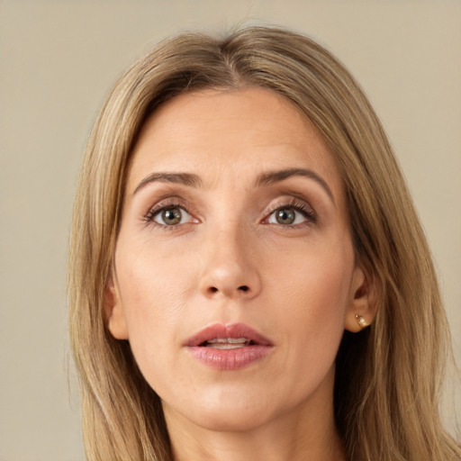 Neutral white young-adult female with long  brown hair and green eyes