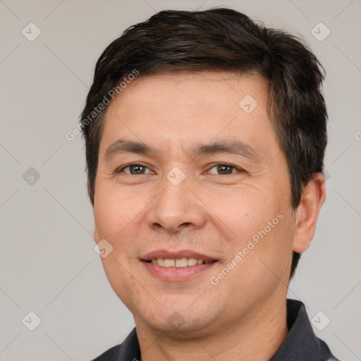 Joyful white adult male with short  brown hair and brown eyes