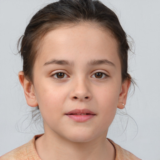 Joyful white child female with medium  brown hair and brown eyes