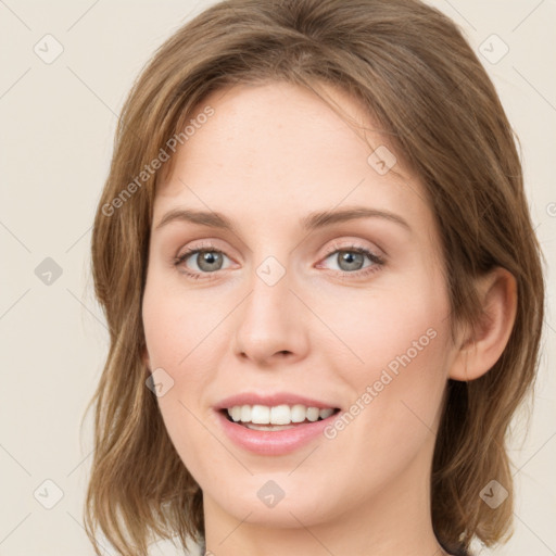 Joyful white young-adult female with medium  brown hair and green eyes