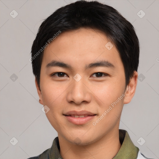 Joyful asian young-adult male with short  black hair and brown eyes