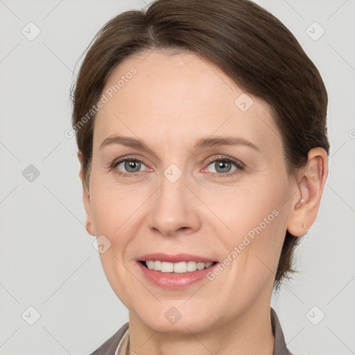 Joyful white adult female with short  brown hair and grey eyes