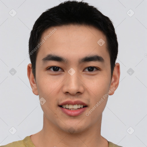 Joyful asian young-adult male with short  black hair and brown eyes