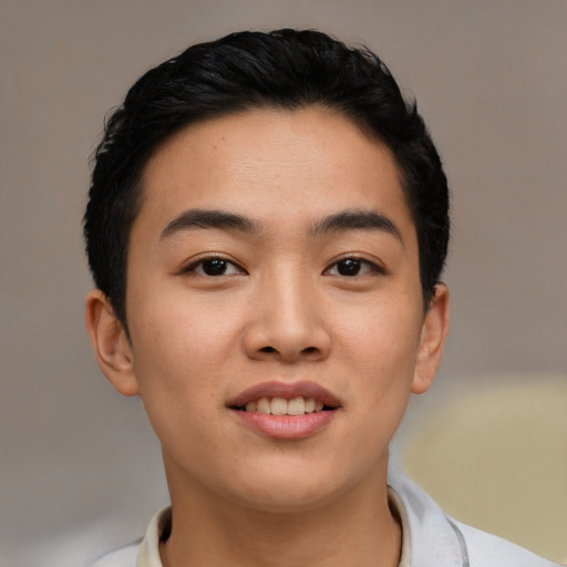Joyful asian young-adult male with short  black hair and brown eyes