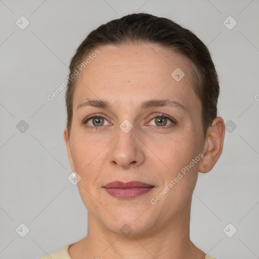 Joyful white adult female with short  brown hair and brown eyes