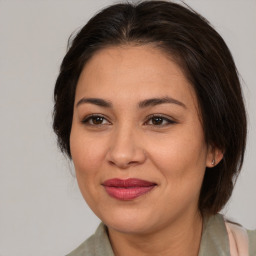 Joyful white adult female with medium  brown hair and brown eyes