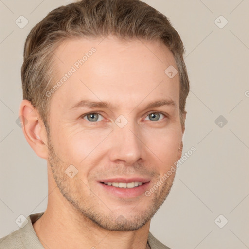 Joyful white young-adult male with short  brown hair and grey eyes