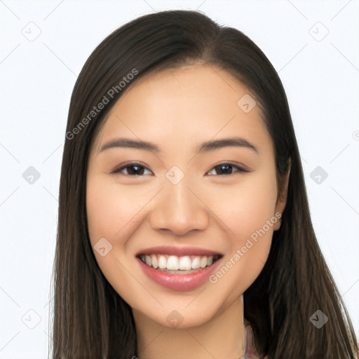 Joyful asian young-adult female with long  brown hair and brown eyes