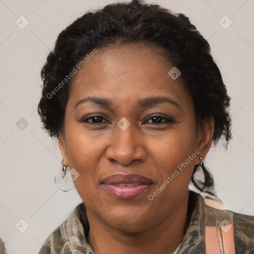 Joyful black adult female with short  brown hair and brown eyes