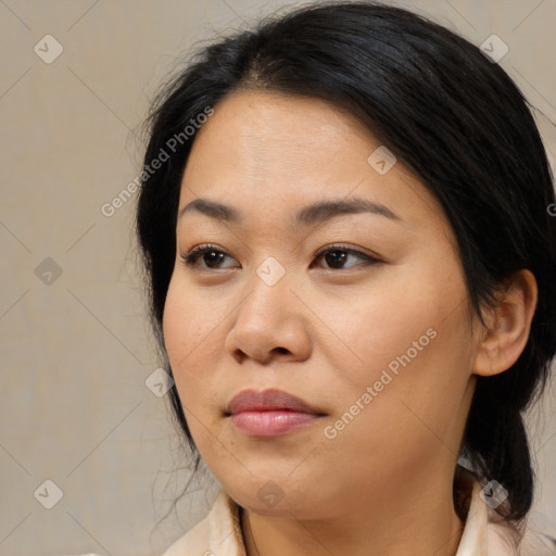 Joyful asian young-adult female with medium  brown hair and brown eyes