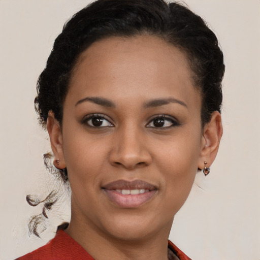 Joyful latino young-adult female with short  brown hair and brown eyes