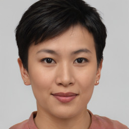 Joyful asian young-adult female with short  brown hair and brown eyes