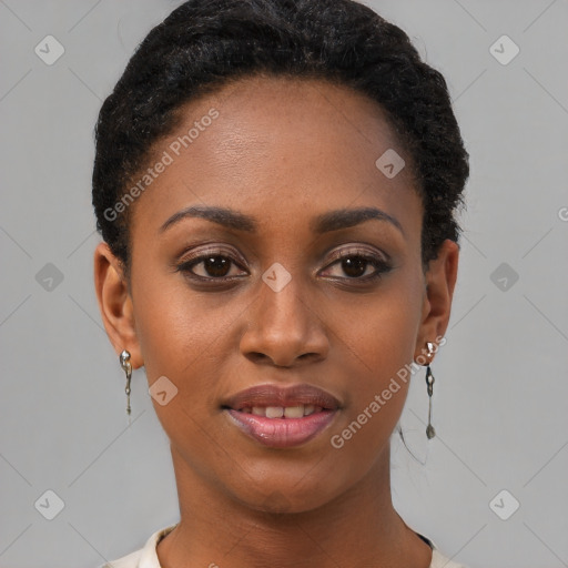 Joyful black young-adult female with short  brown hair and brown eyes