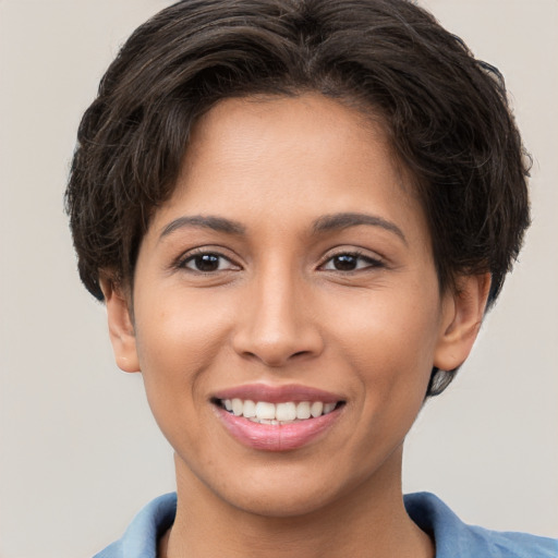 Joyful white young-adult female with short  brown hair and brown eyes