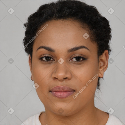 Joyful black young-adult female with short  black hair and brown eyes