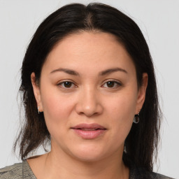 Joyful white young-adult female with medium  brown hair and brown eyes