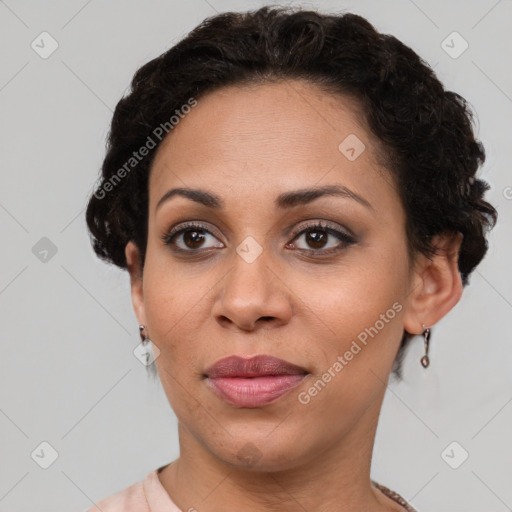 Joyful latino adult female with short  brown hair and brown eyes