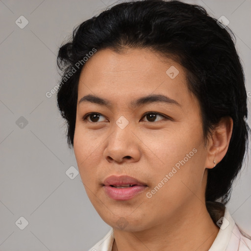 Joyful asian young-adult female with medium  black hair and brown eyes