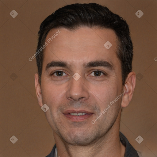 Joyful white adult male with short  black hair and brown eyes