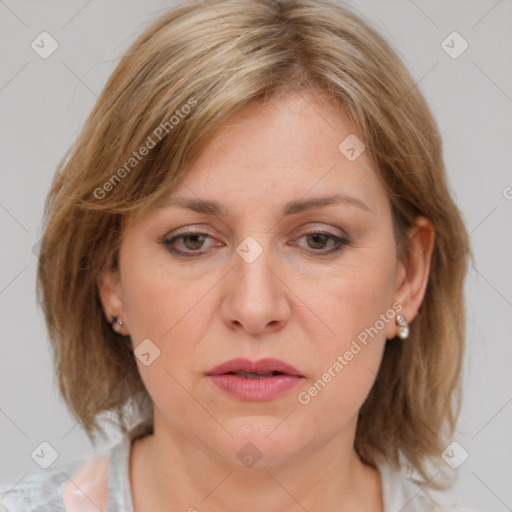 Joyful white adult female with medium  brown hair and blue eyes