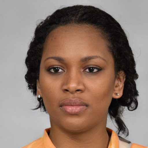 Neutral black young-adult female with medium  black hair and brown eyes